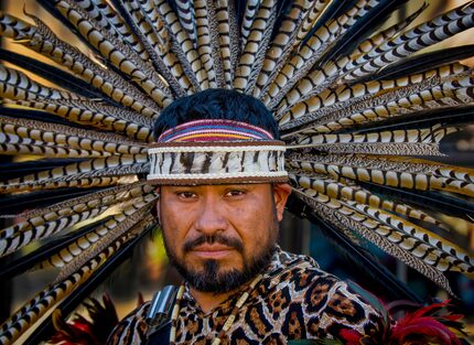 Jose Guzman, of Tyler, Texas, a member of Danza Guerreros Chichimecas Tonantzin, waits to...