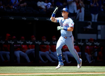 Texas Rangers  Nathaniel Lowe (30) gestures after hitting a two-run home run against the Los...