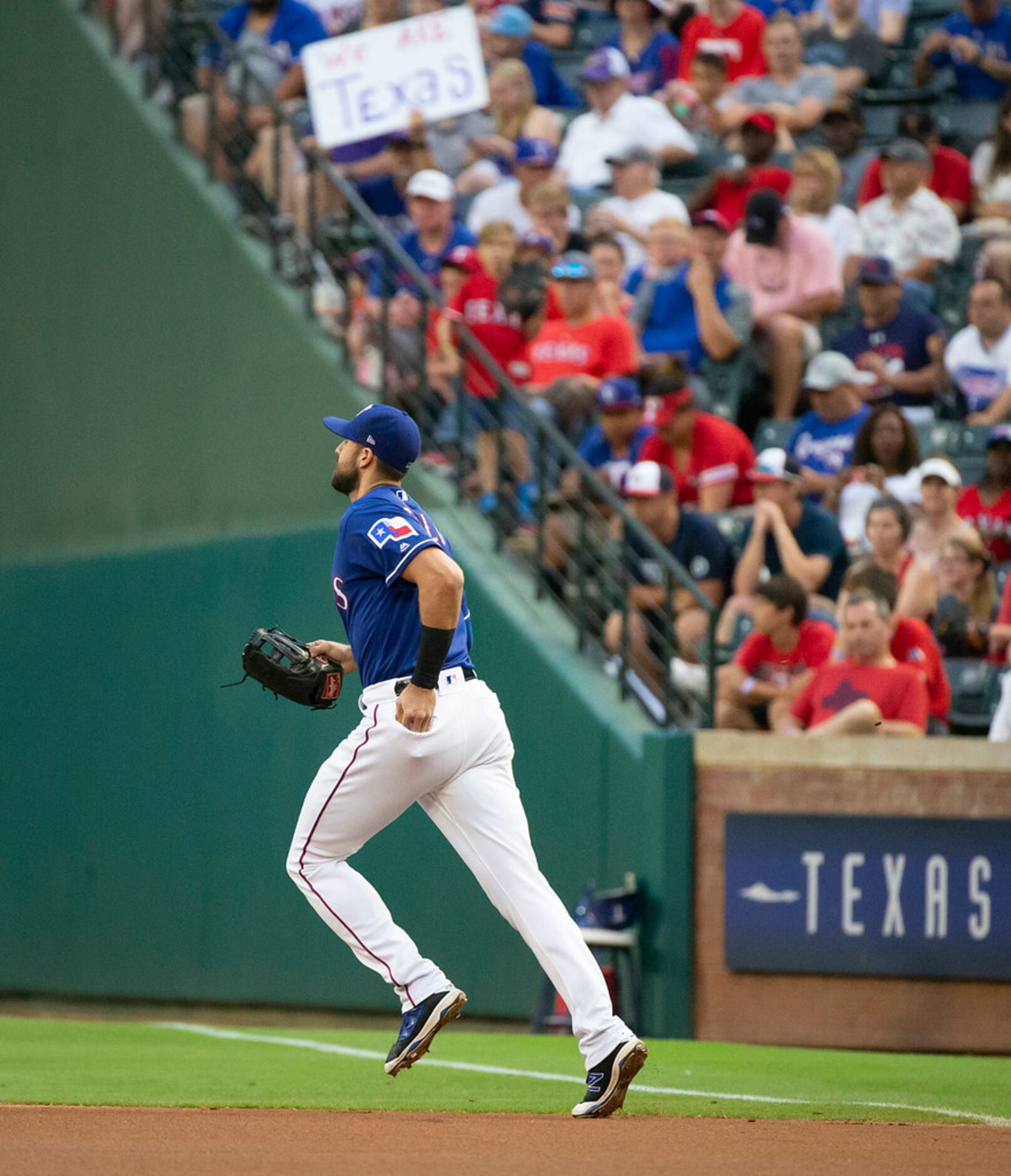 Texas Rangers center fielder Joey Gallo heads to his position as he takes the field for the...