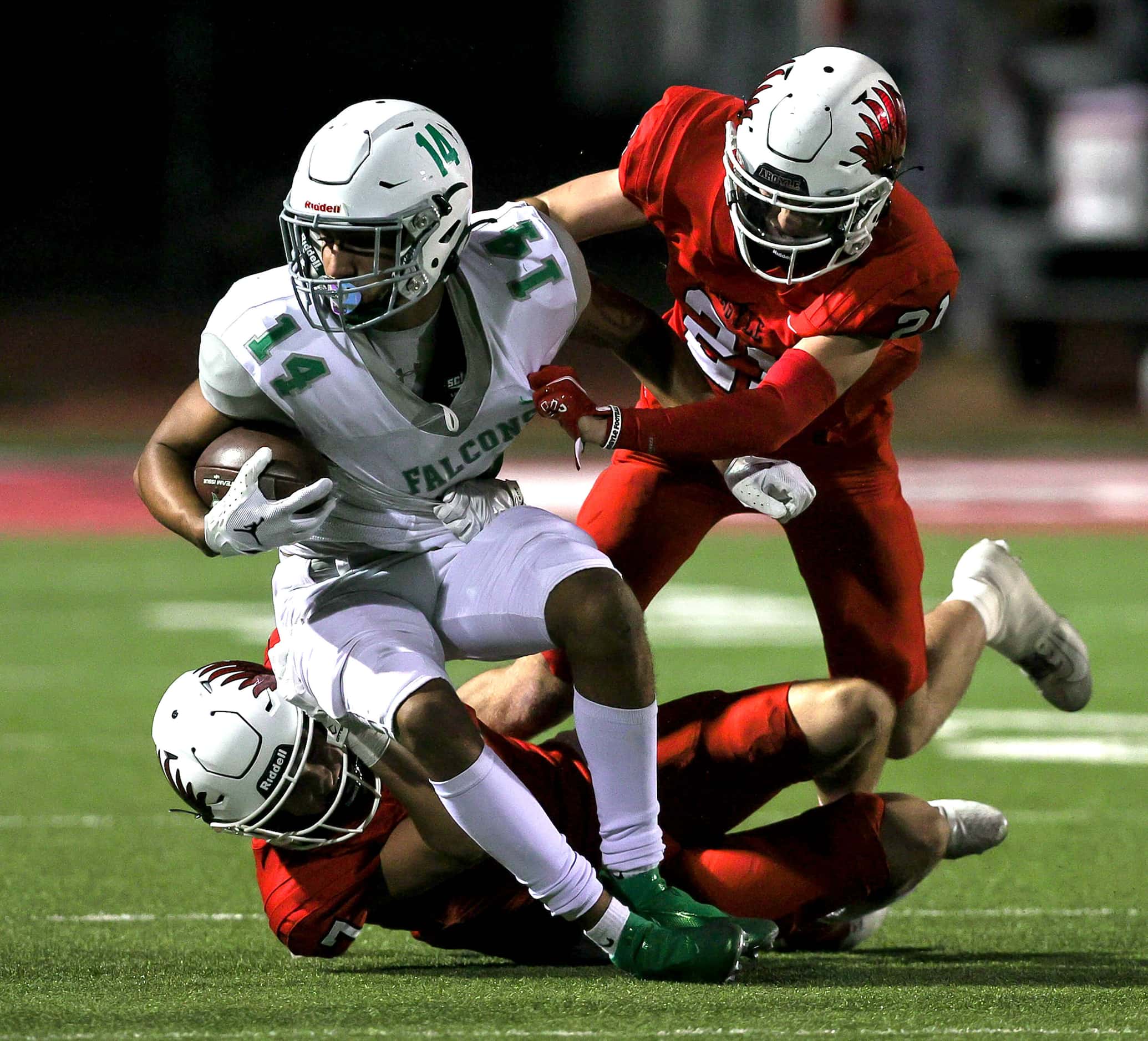 Lake Dallas wide receiver Evan Weinberg (14) comes up with a reception against Argyle...