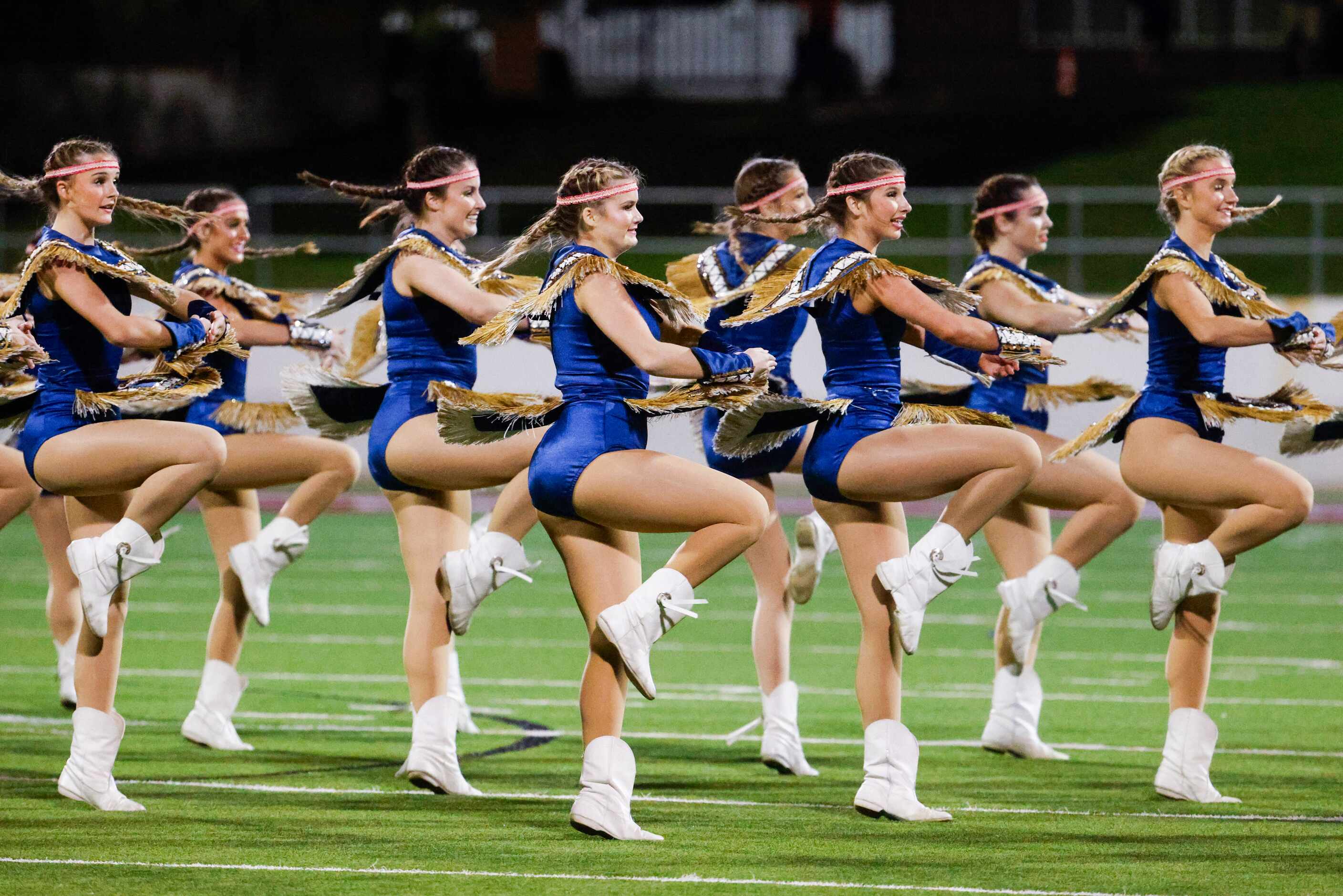 Keller High dance team performs during the half time of a football game against Byron Nelson...