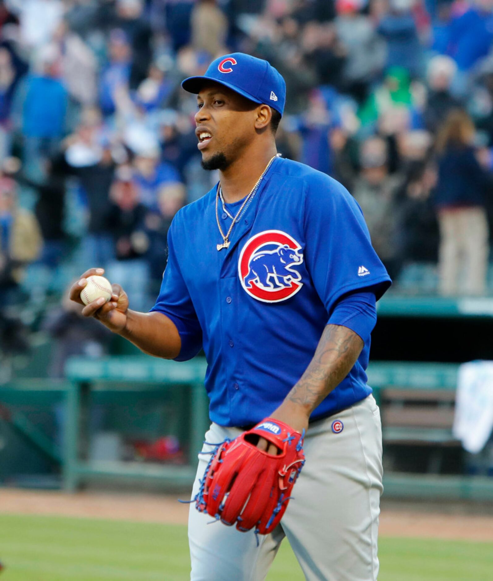 Chicago Cubs Pedro Strop holds the game ball after giving up a run on a wild pitch to end...