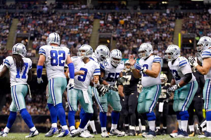 Dallas Cowboys offense breaks the huddle in the third quarter against the New Orleans Saints...