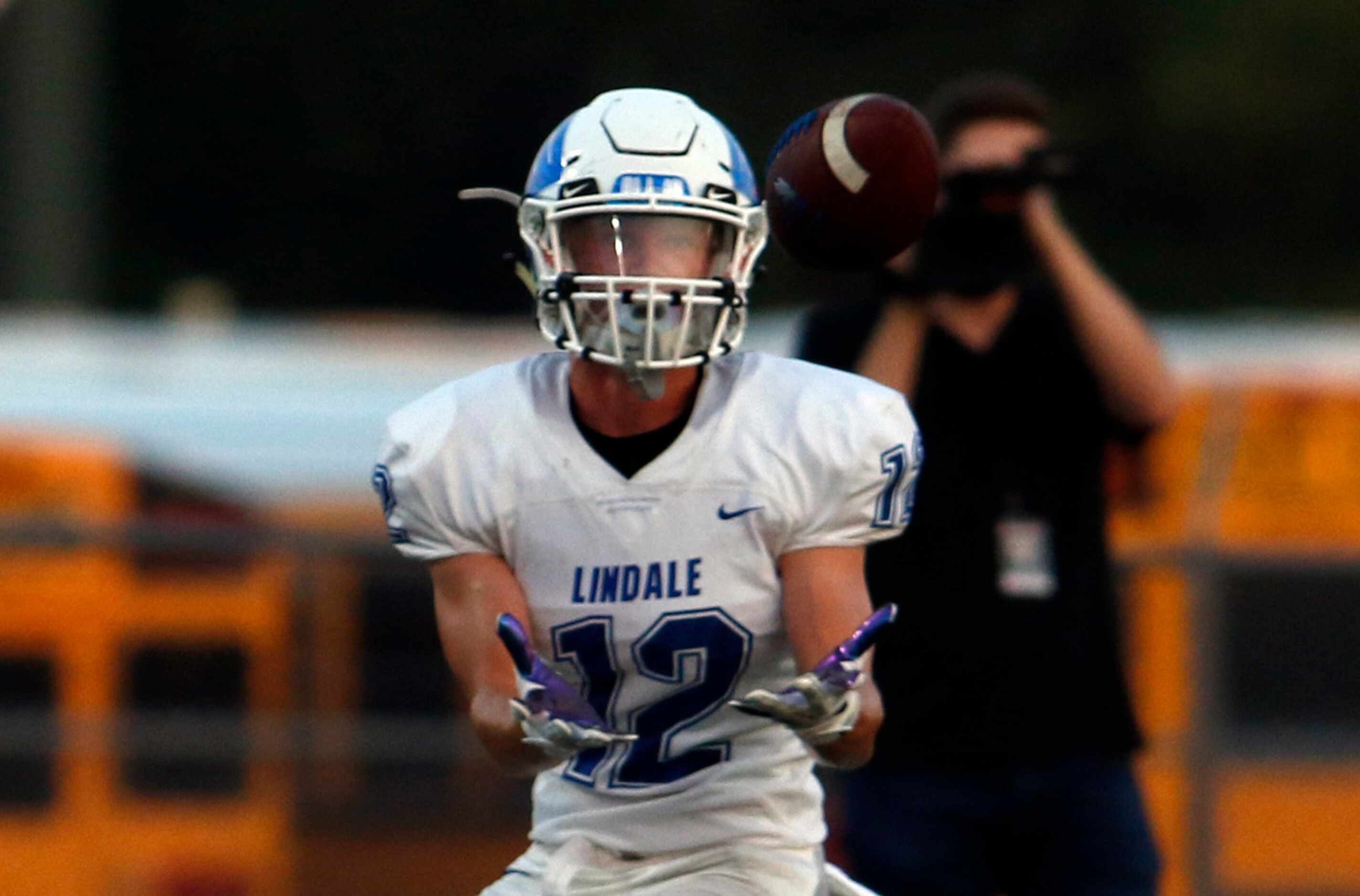 Lindale receiver Daniel Franke (12) pulls in a reception which set up a first quarter...
