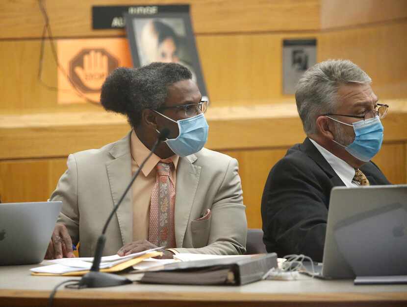 Victor Williams (left) listens during his trial in July.