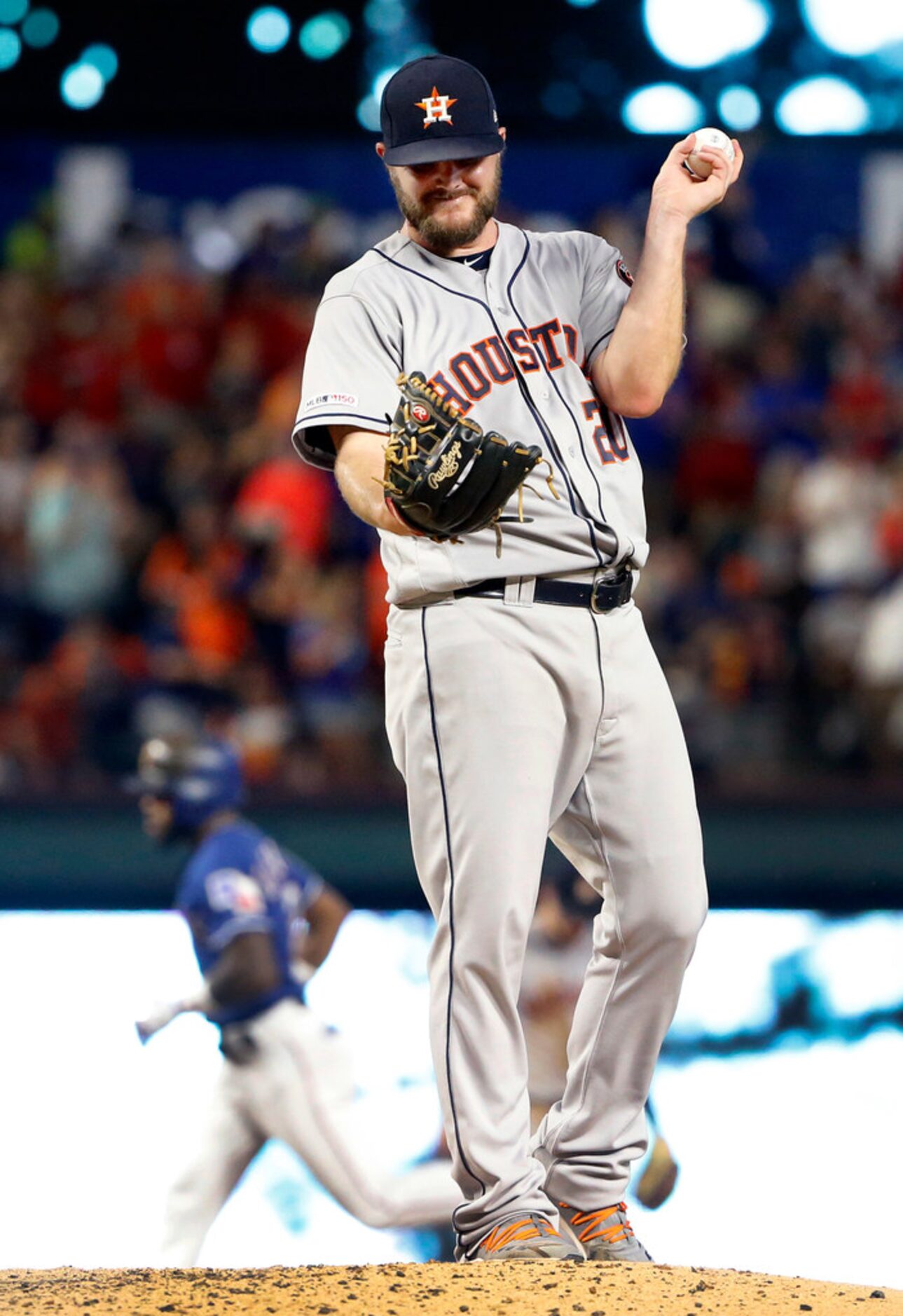 Houston Astros starting pitcher Wade Miley (20) reacts after giving up a home run to Texas...