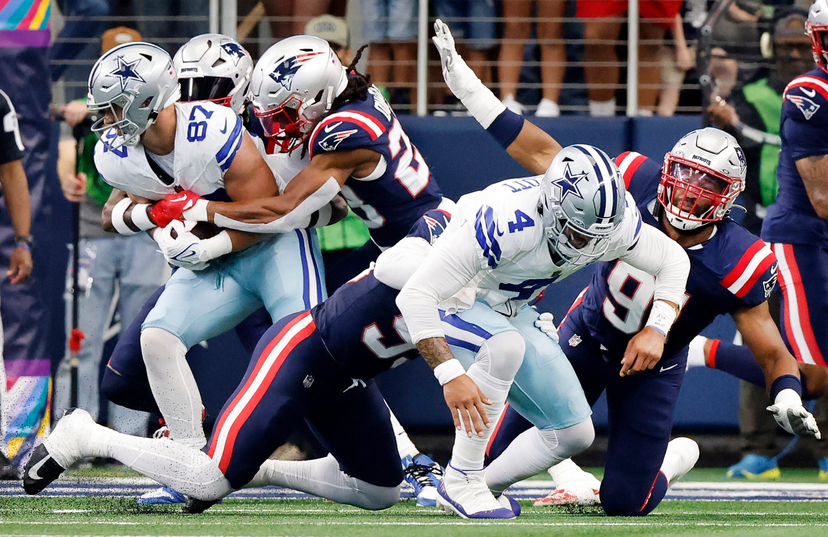 Dallas Cowboys tight end Jake Ferguson (87) catches a short pass from Dallas Cowboys...