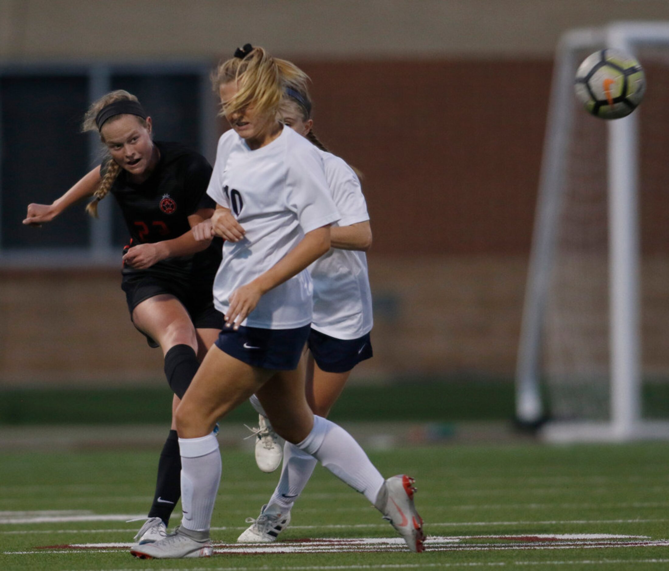 Coppell's Maya Ozymy (22) watches her shot as it clears around Keller's Frankie Nine (10)...