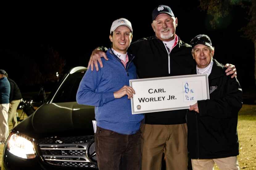 Carl Worley Jr., golf pro at Hide-A-Way Lake, stands between Fin Ewing IV (left) and Fin...