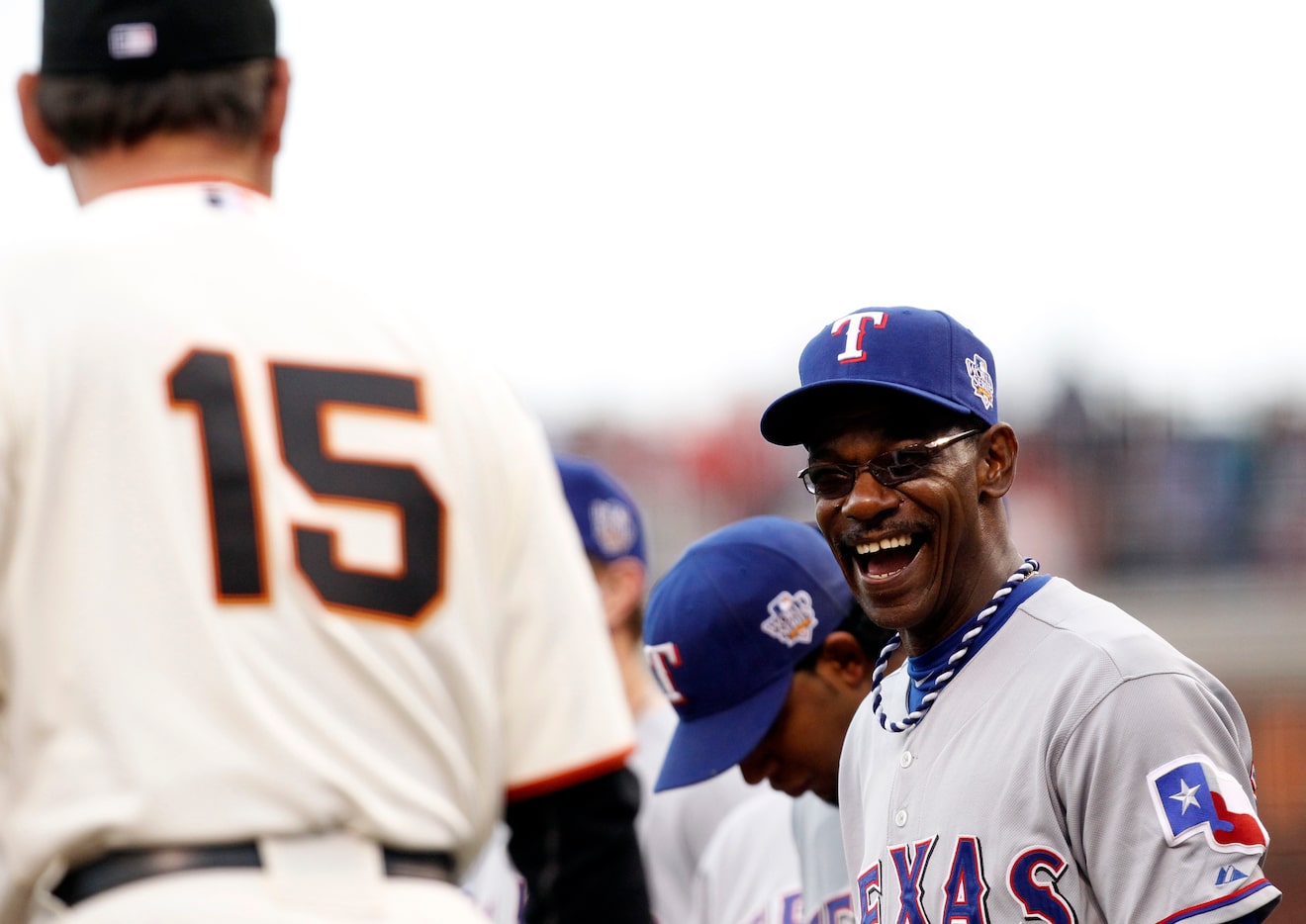 Texas Rangers manager Ron Washington shares a laugh with San Francisco Giants manager Bruce...