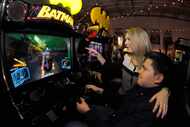 Tori VanBuskirk and Ruben Ortega maneuver through a Batman video game at Cidercade in...