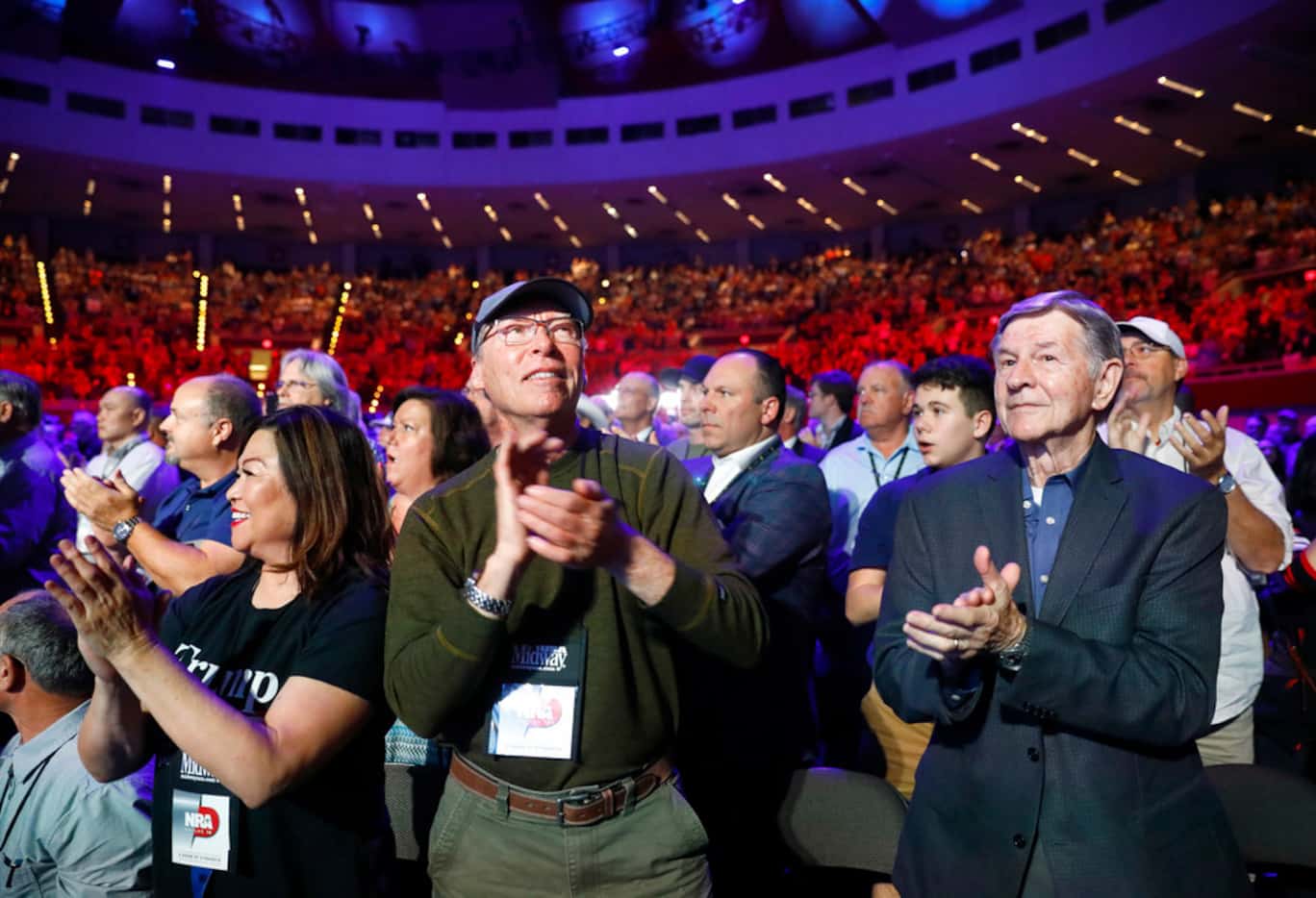 NRA supporters applaud Vice President Mike Pence who was speaking at the NRA's annual...