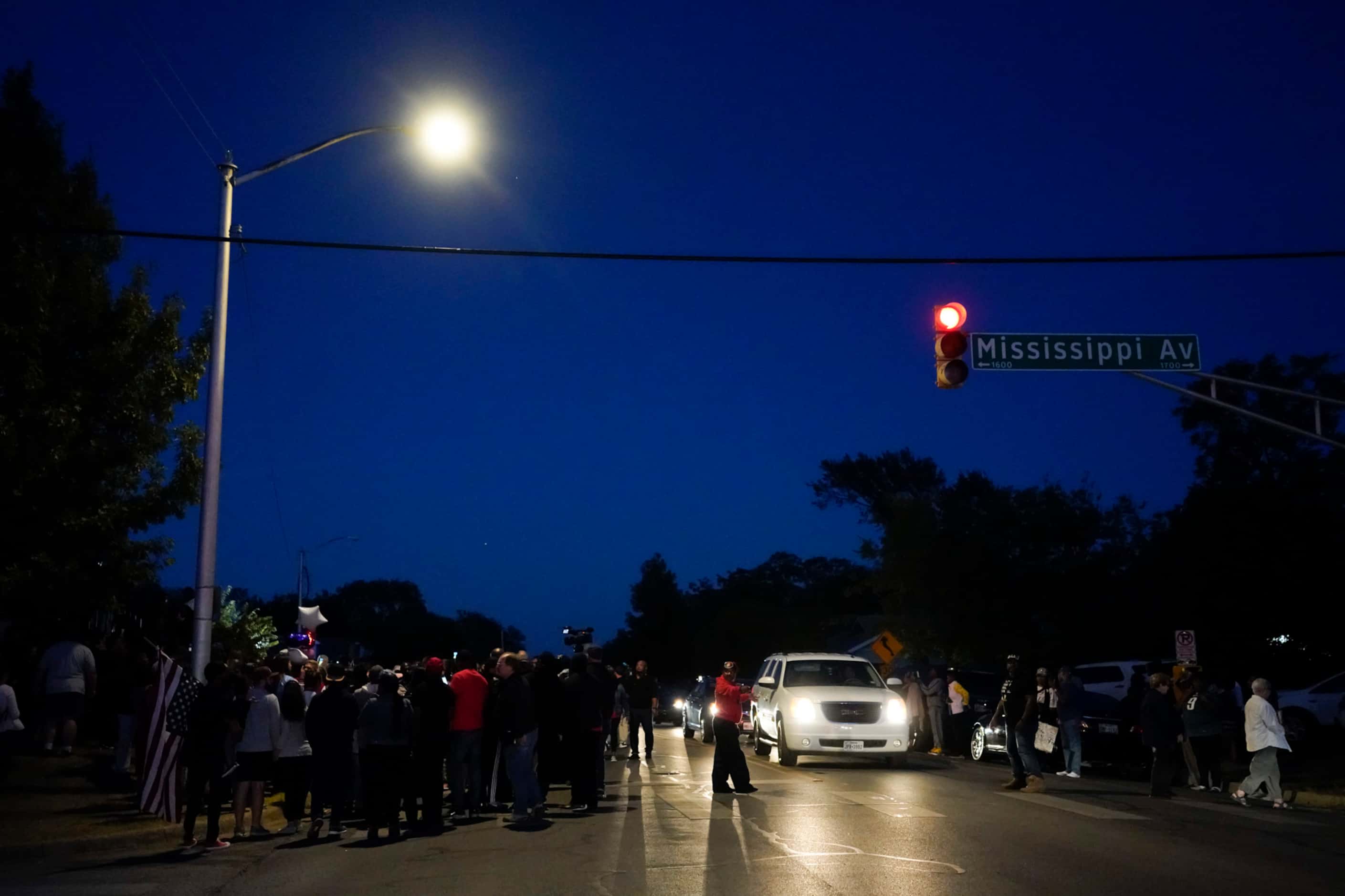 A large crowd of protestors gathers in the neighborhood where Atatiana Jefferson was shot...