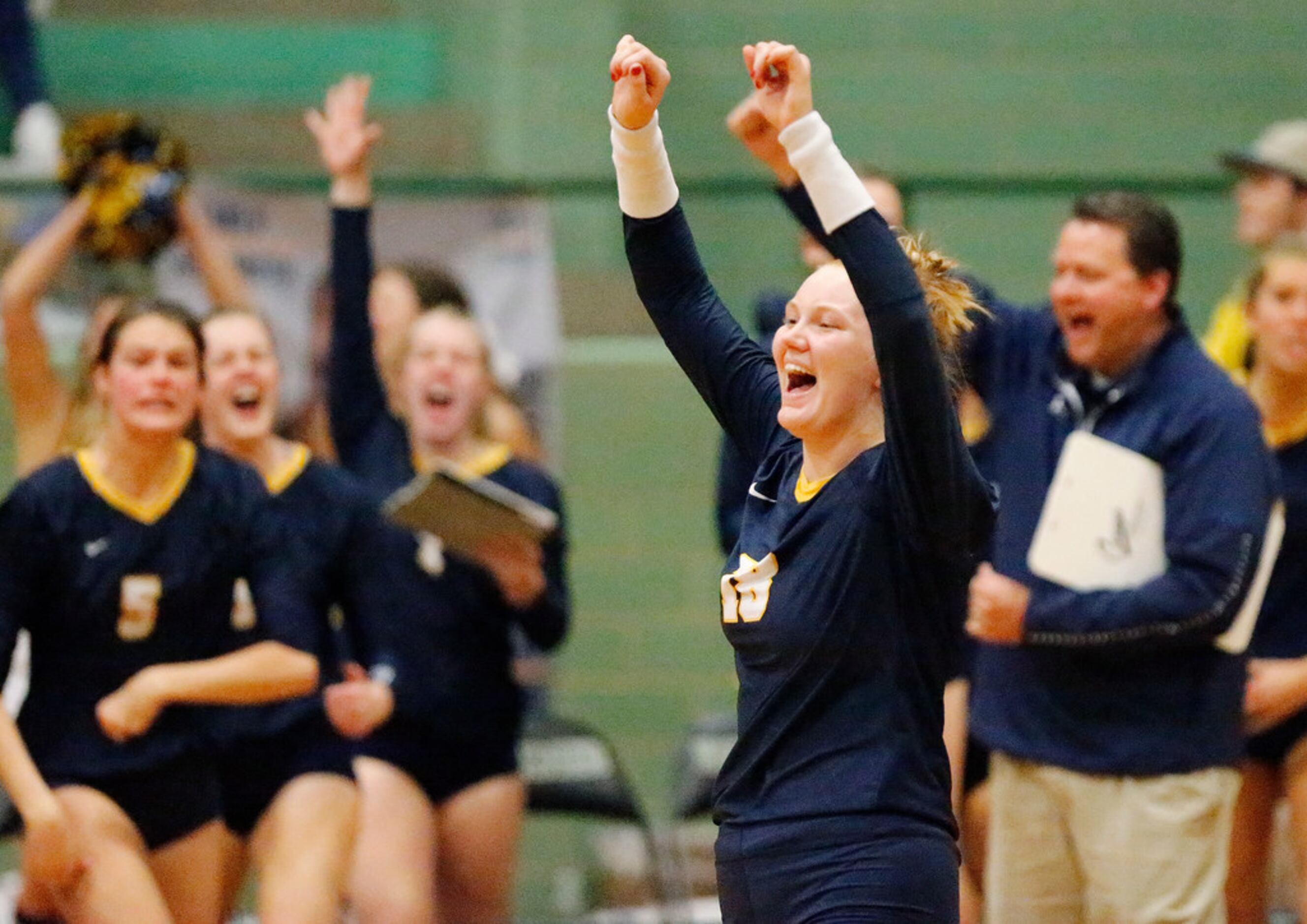 Highland Park High School outside hitter Kendyl Reaugh (18) celebrates a point  during game...
