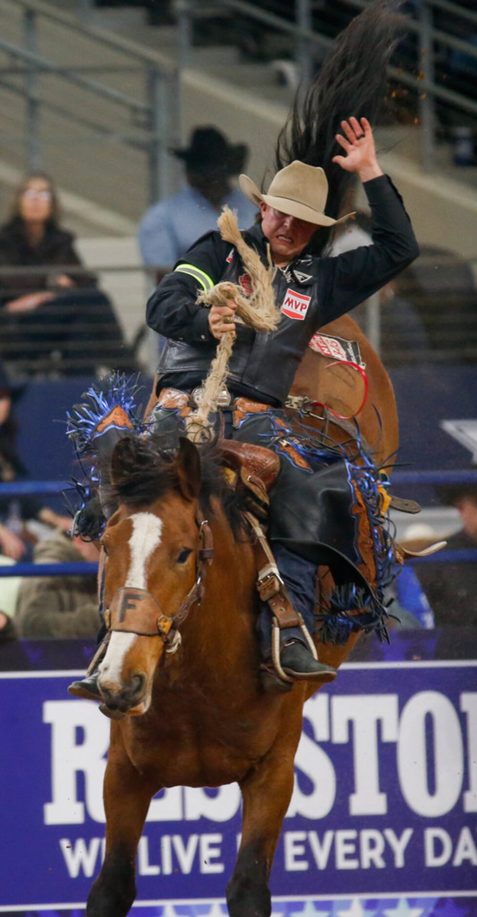 Saddle Bronc rider Wyatt Casper of Pampa, TX competes in RFD-TV's The American rodeo at AT&T...