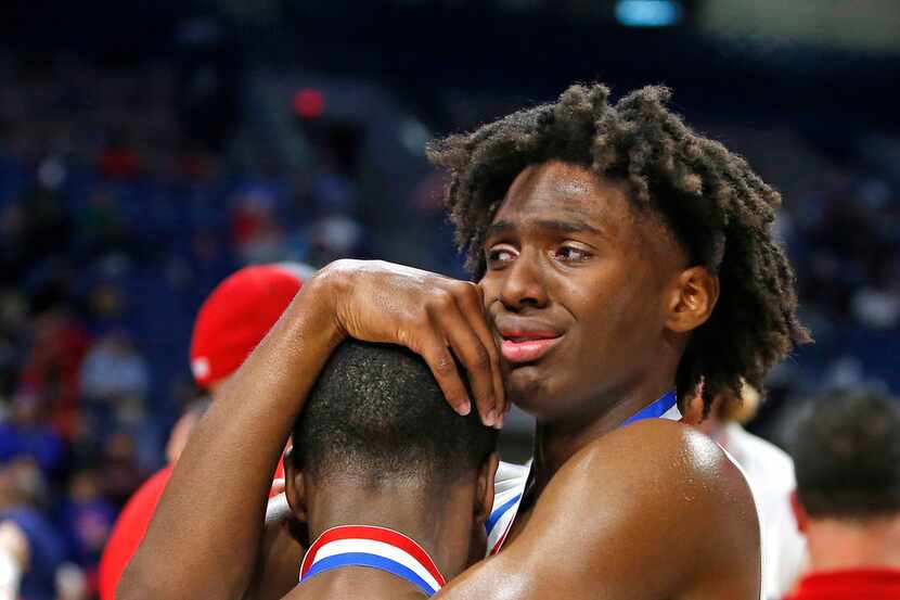 South Garland's Tyrese Maxey consoles Jordan Chambers from Friday's Class6A boys basketball...
