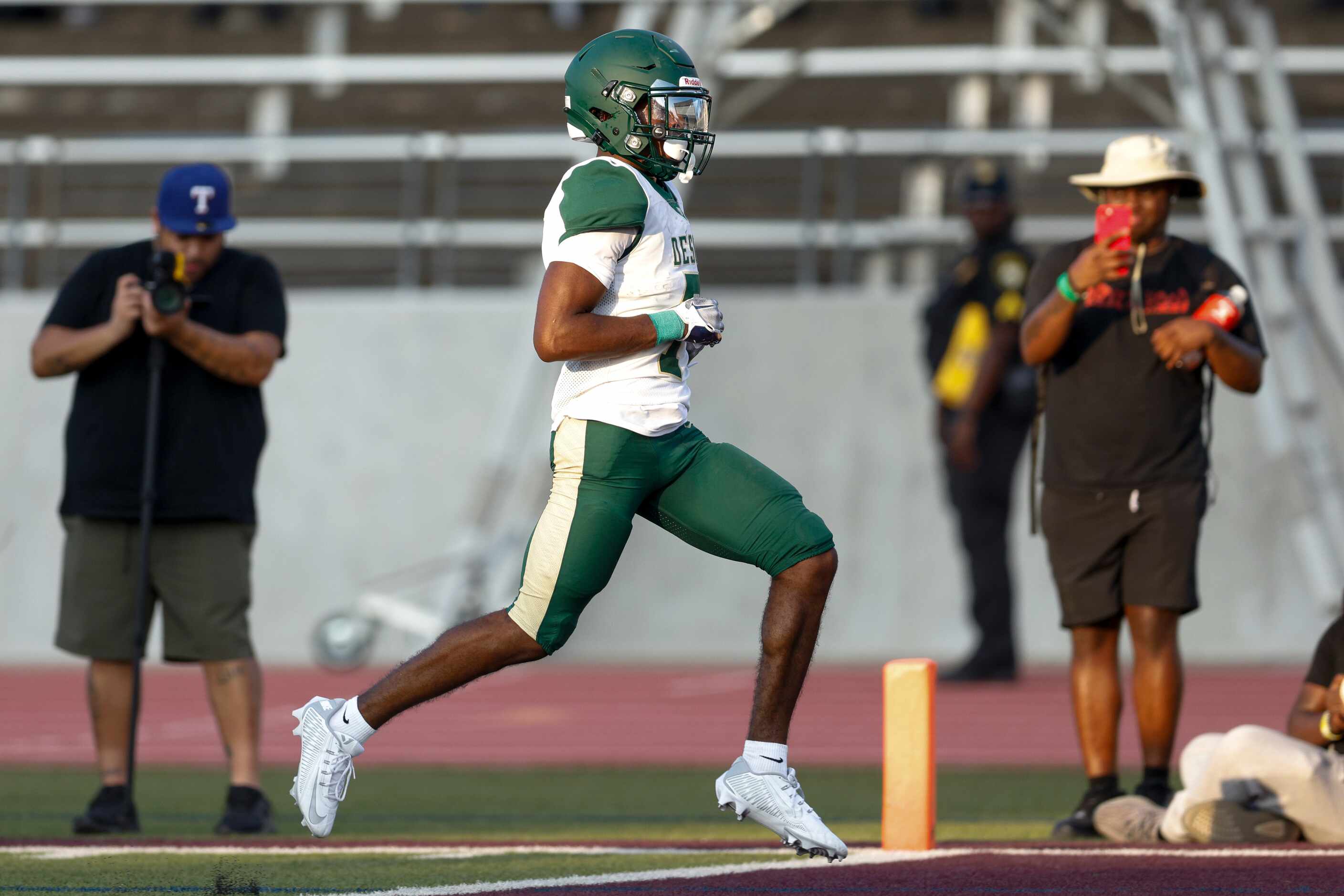 DeSoto wide receiver Antonio Pride Jr. (7) strides into the end zone after making a catch...
