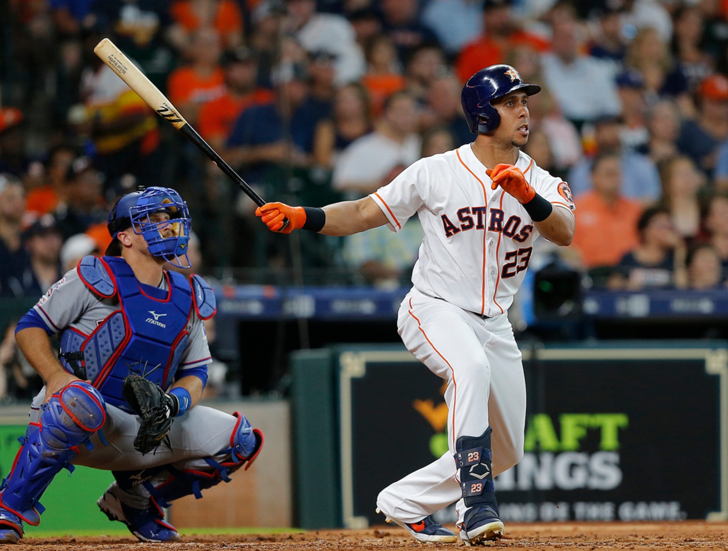 HOUSTON, TEXAS - JULY 20: Michael Brantley #23 of the Houston Astros hits a RBI double in...