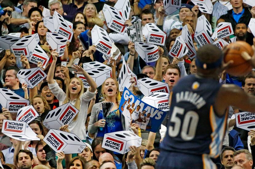 Mavericks fans try to distract Memphis' Zach Randolph (50) as he shoots a free throw in the...