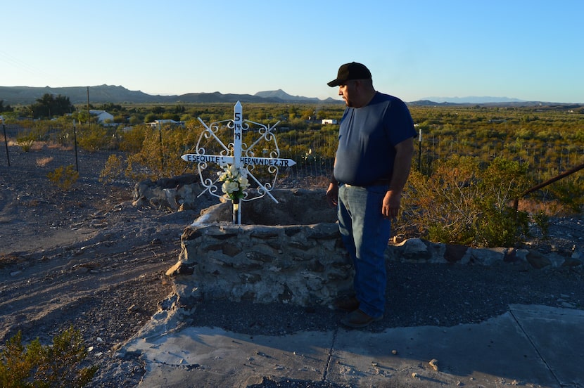 Presidio police Chief Margarito Hernandez looks down at the spot where his younger brother...