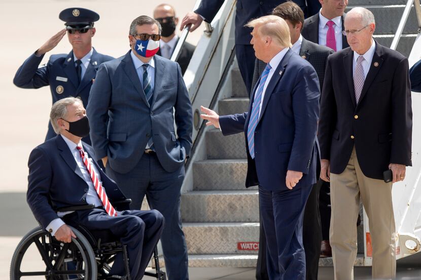 President Donald Trump chats with Texas Gov. Greg Abbott and Sen. Ted Cruz, with Rep. Mike...