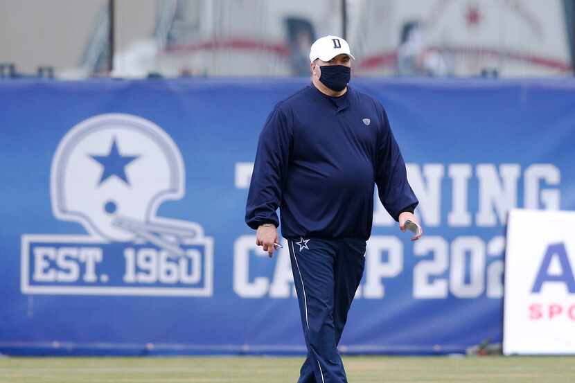 Dallas Cowboys head coach Mike McCarthy walks the field at practice during training camp at...
