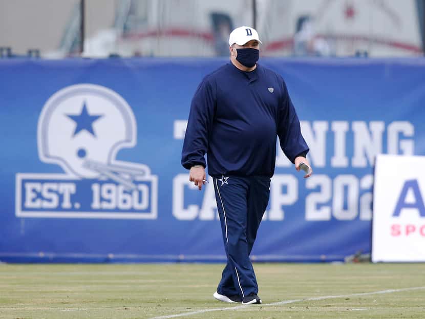Dallas Cowboys head coach Mike McCarthy walks the field at practice during training camp at...