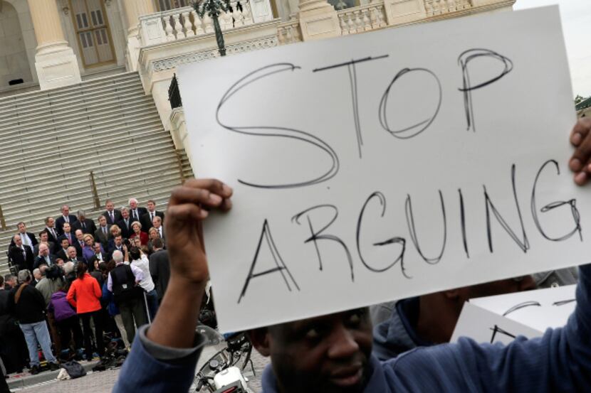 A protest sign in front of the Capitol on Wednesday represented the feelings of many about...
