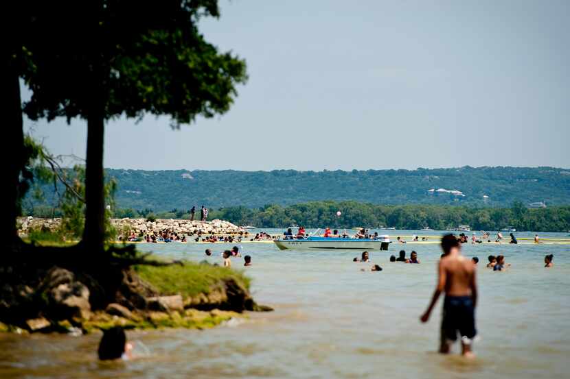 Families play in the water at Lynn Creek Park on Joe Pool Lake on June 24, 2012 in Grand...