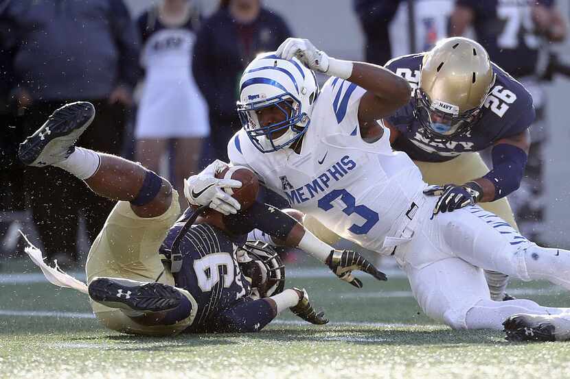 ANNAPOLIS, MD - OCTOBER 22: Anthony Miller #3 of the Memphis Tigers is tackled by Sean...