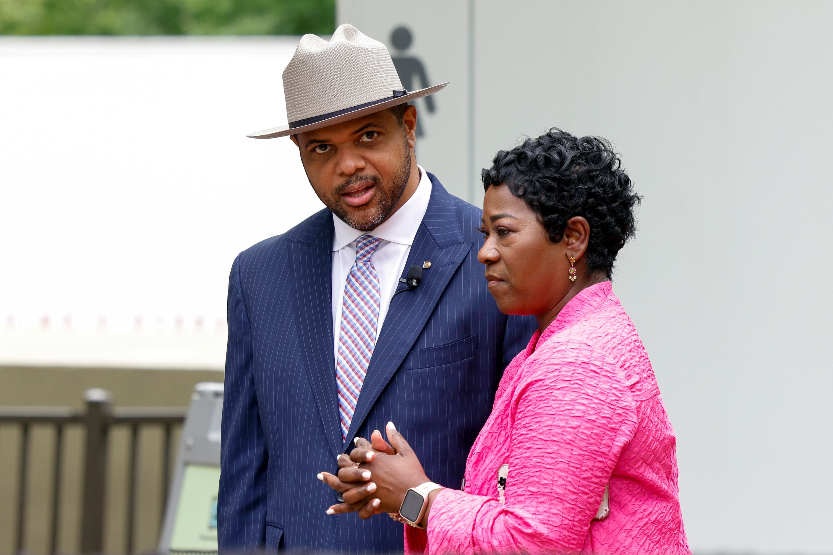 Dallas Mayor Eric Johnson speaks with interim city manager Kimberly Bizor Tolbert at Klyde...