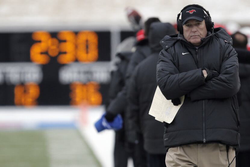 SMU head coach June Jones walks the sidelines during the second half of a college football...