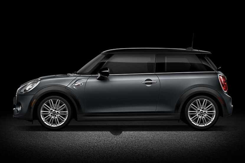 
The 2015 Mini Cooper Hardtop has a familiar look: extremely short hood, brief fenders with...