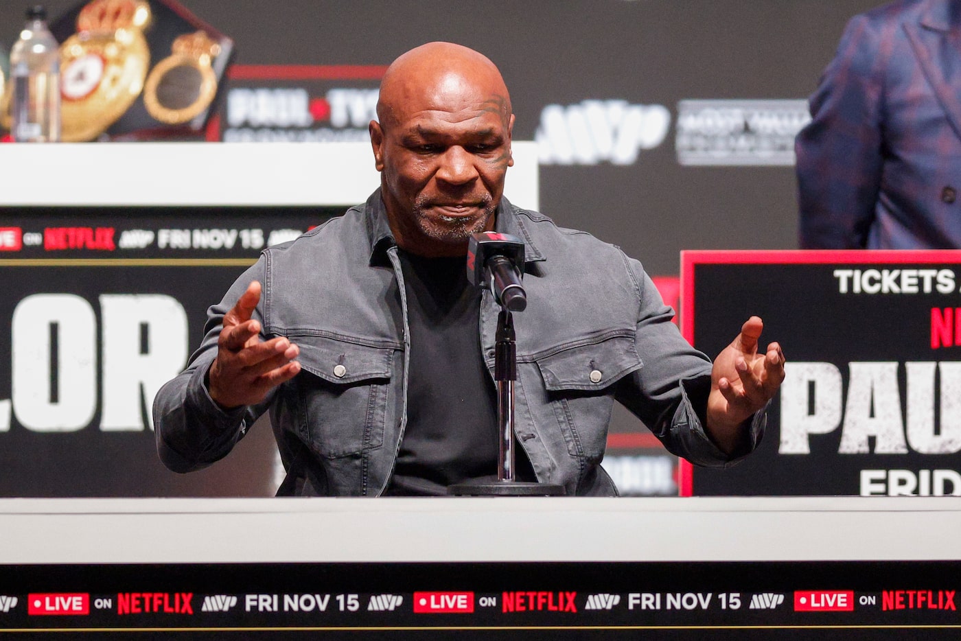 Mike Tyson reacts as he answers a question during a news conference ahead of his boxing...