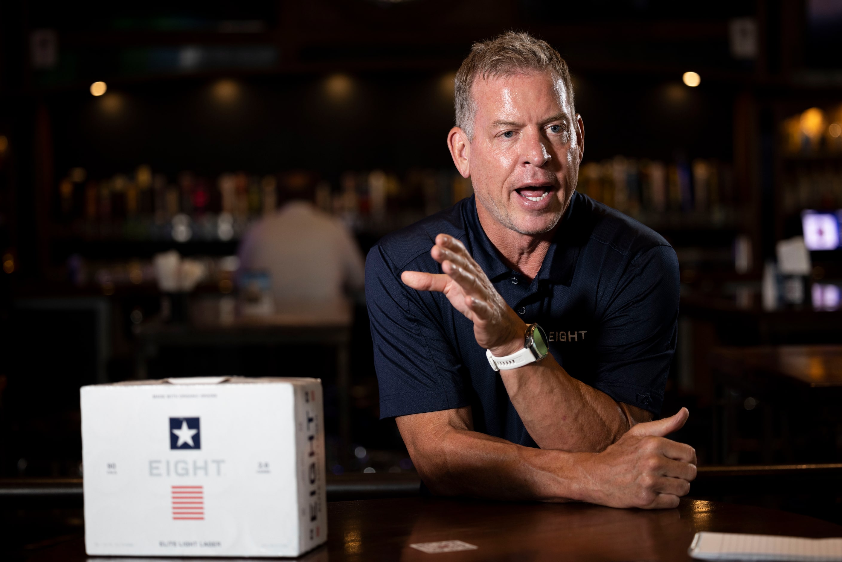 Former Cowboys quarterback Troy Aikman speaks to reporters at Katy Trail Ice House during a...