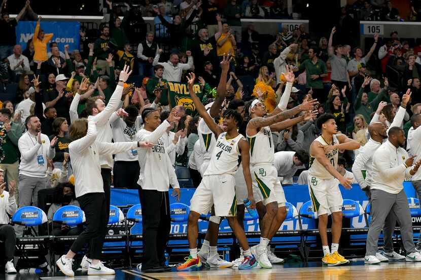 Baylor players celebrate the team's 92-67 win against the Colgate in a first-round college...