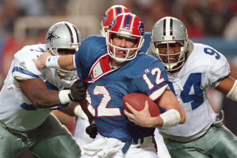 Jim  Jeffcoat (L) and Charles Haley(R) sack Bills quarterback Jim Kelly.
