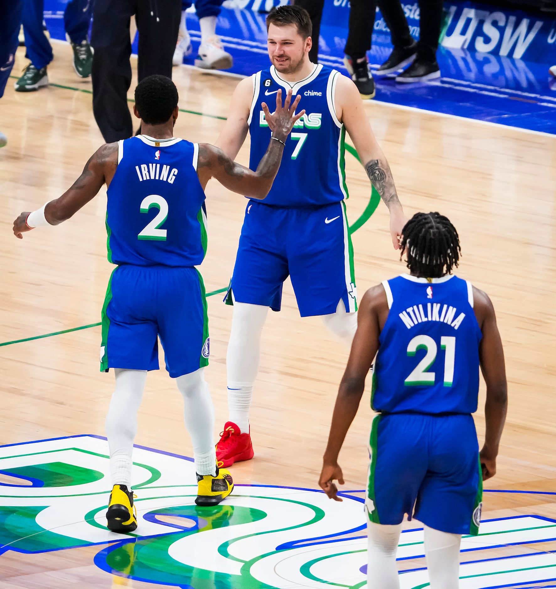 Dallas Mavericks guard Luka Doncic (77) celebrates with guard Jaden Hardy (3) after a...