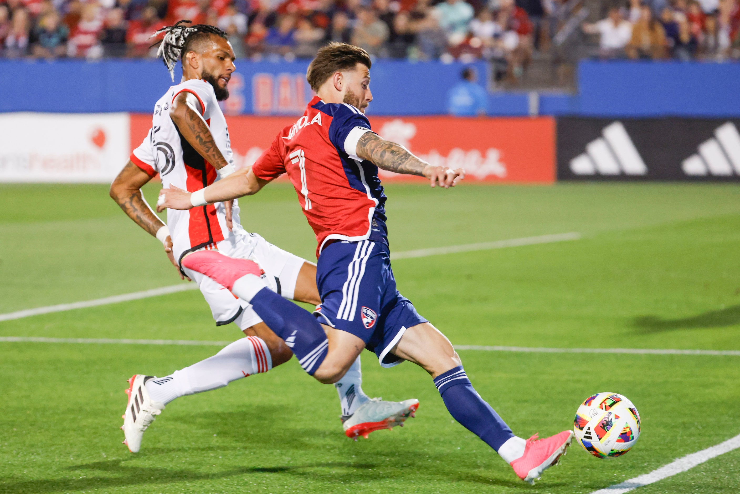 San Jose defender Rodrigues (back) defends as FC Dallas forward Paul Arriola attempt to...