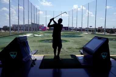 Jared Tiner practices his swing at Topgolf in The Colony, Texas on Wednesday June 22, 2022.
