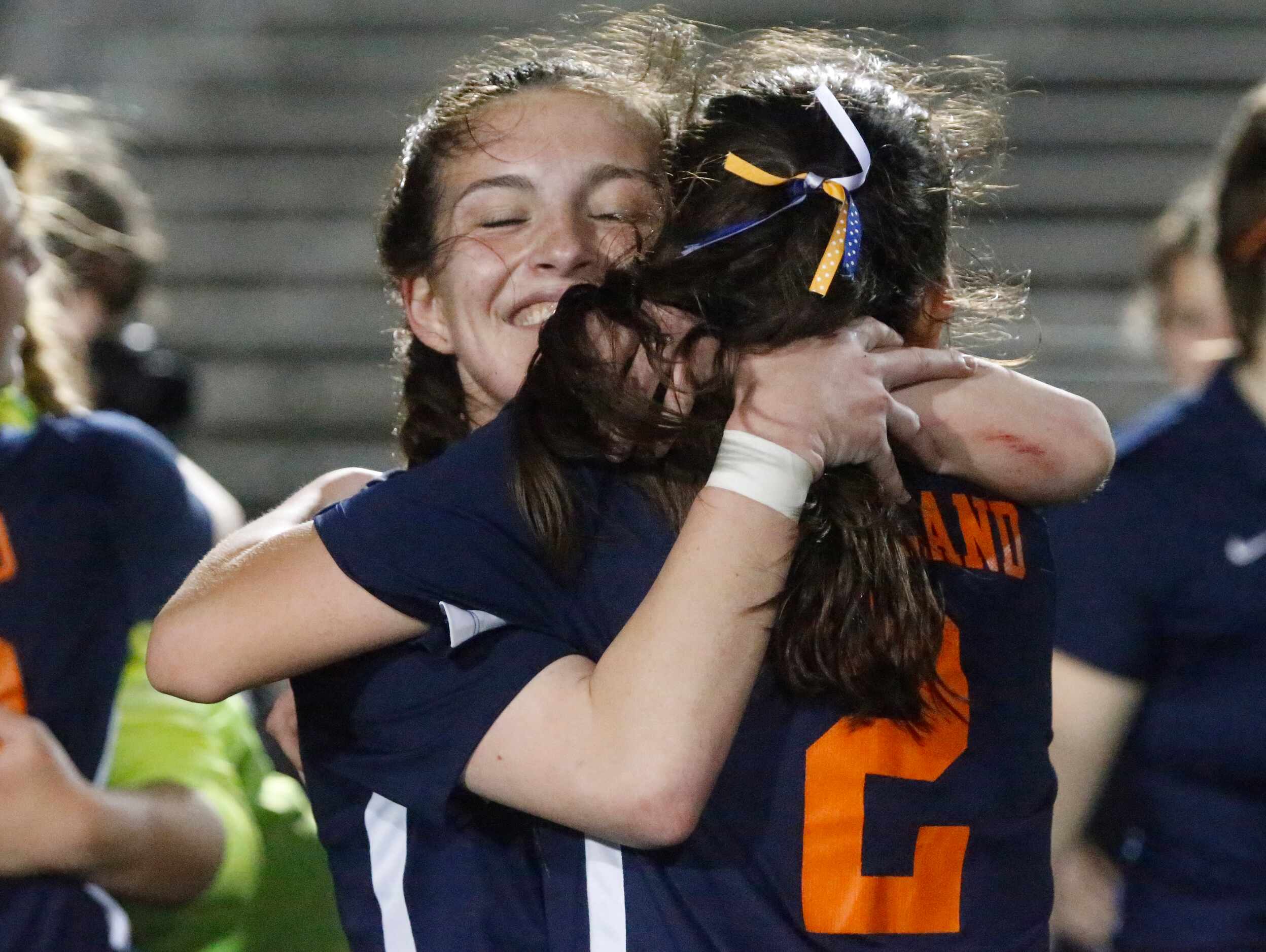 Wakeland midfielder Allie Perry (15) hugs midfielder Rachel Perry (2) after winning the...