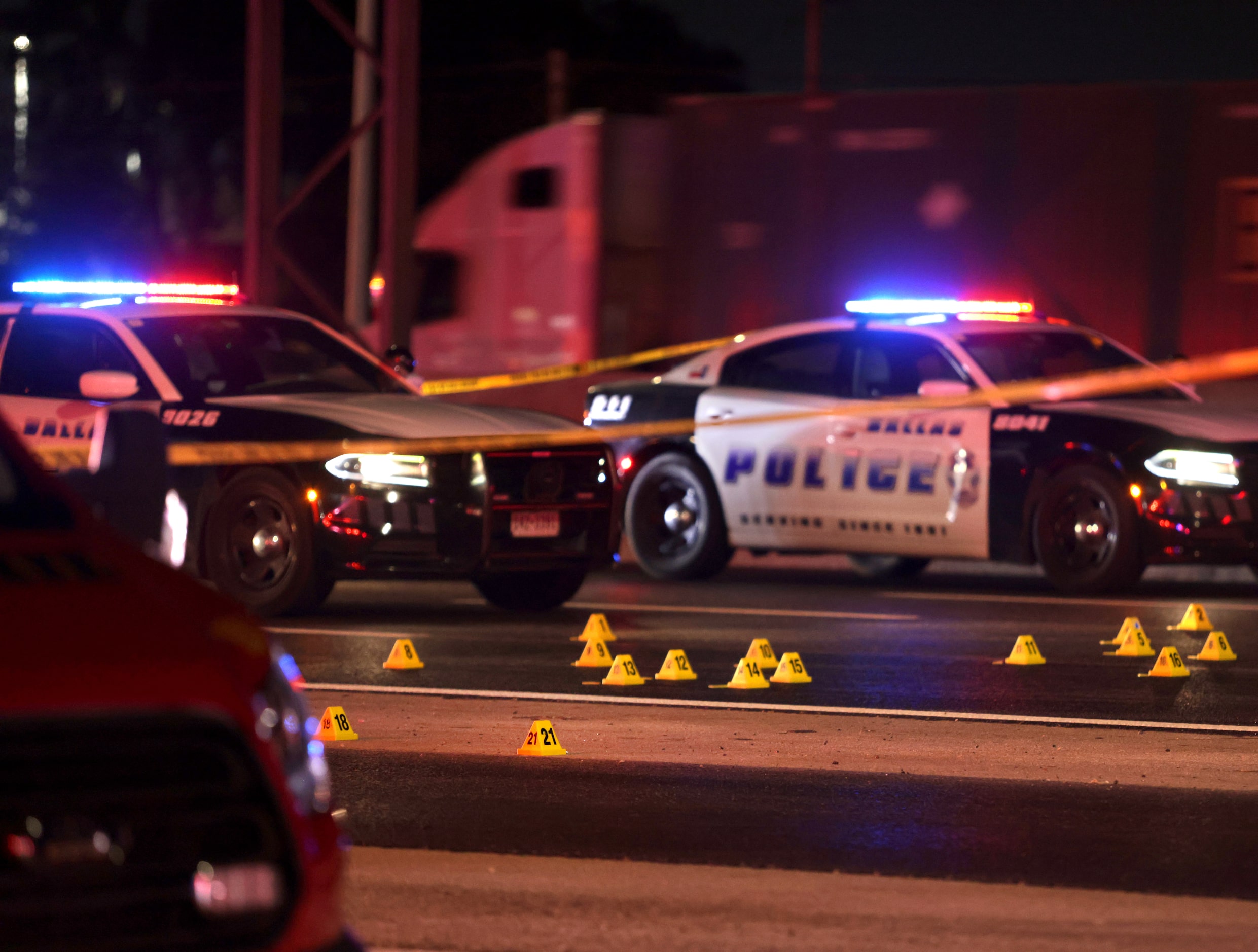 Evidence markers cover Interstate 35 where a suspected gunman was killed early Thursday in...