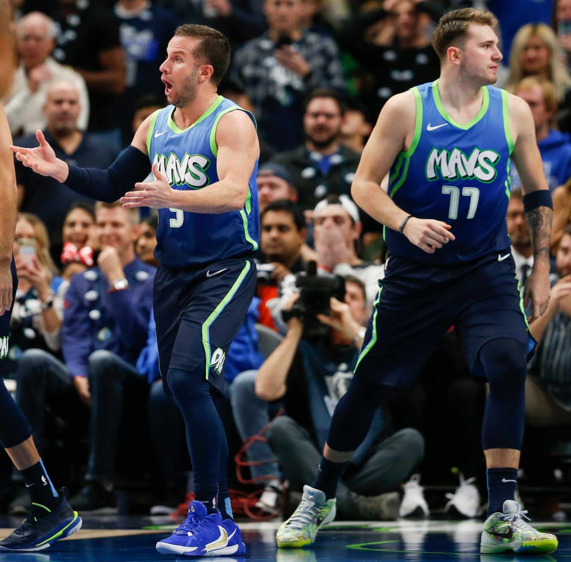 Dallas Mavericks guard J.J. Barea (5) reacts to an official's call alongside Dallas...