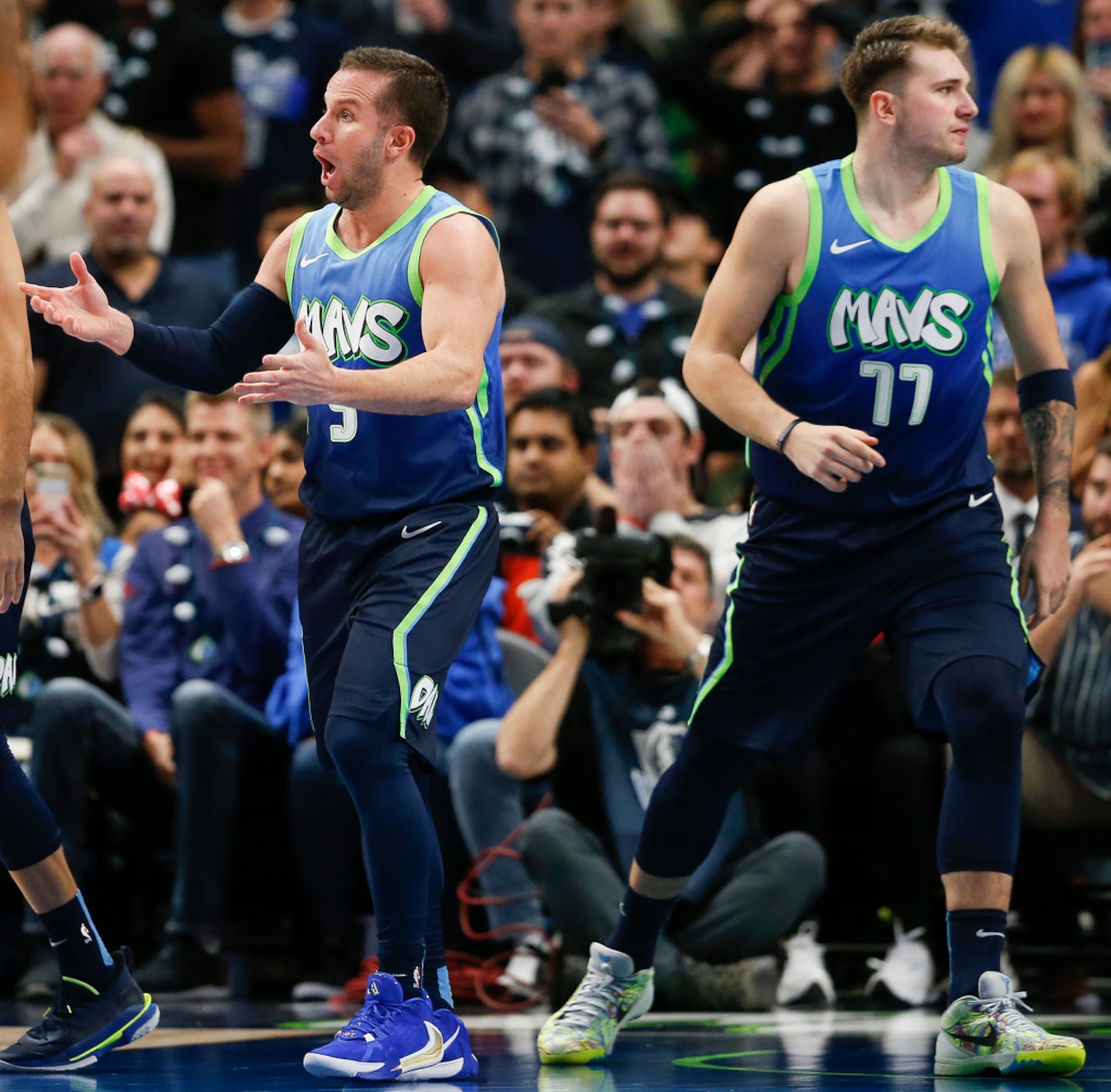 Dallas Mavericks guard J.J. Barea (5) reacts to an official's call alongside Dallas...