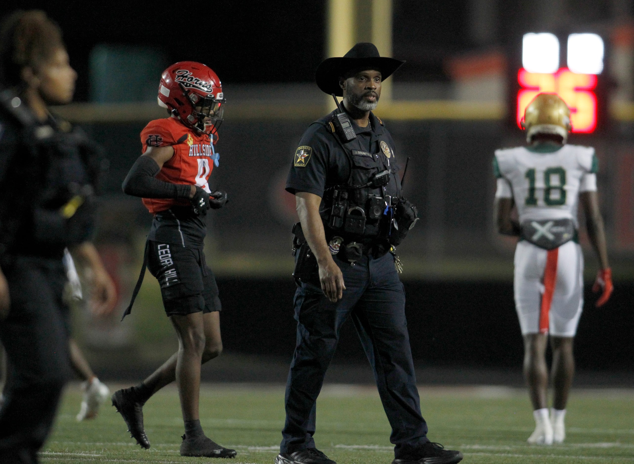 Police officers help restore order after a disagreement elevated between Cedar Hill and...