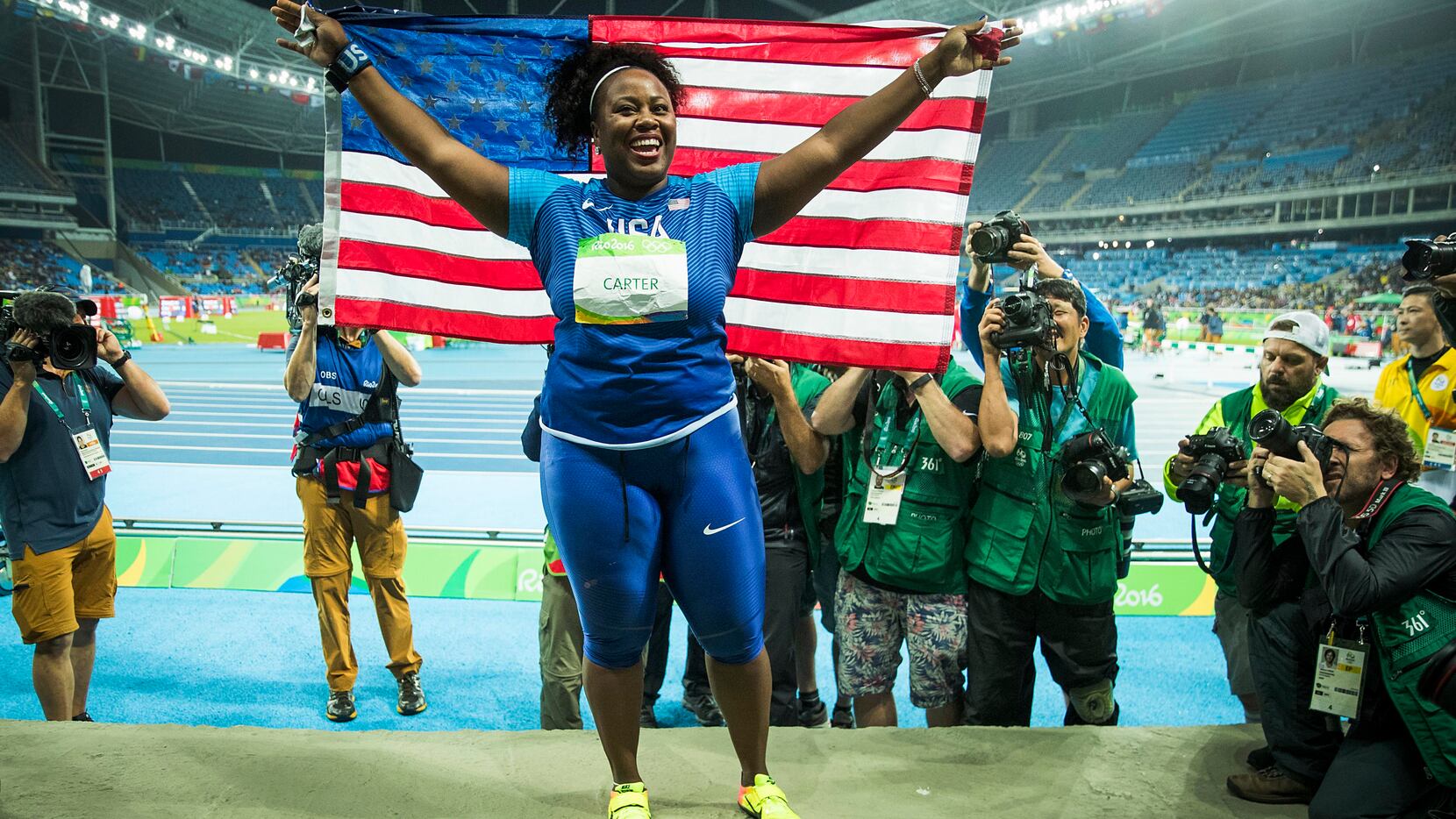 Michelle Carter celebrates after winning the women's shot put gold medal on the first day of...