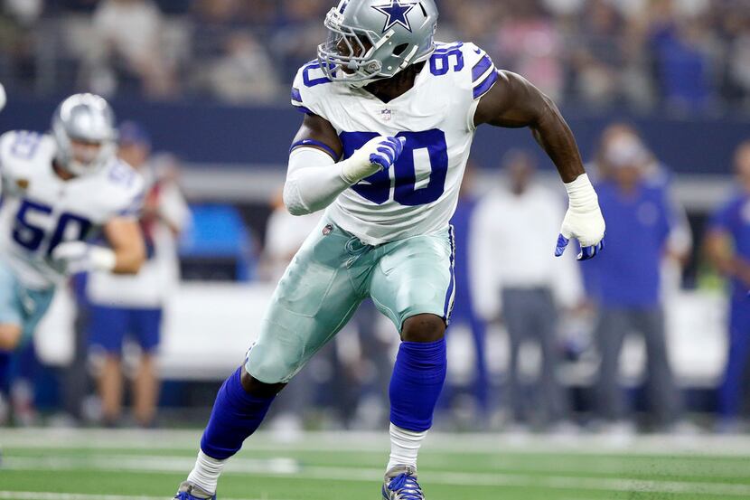 Dallas Cowboys defensive end Demarcus Lawrence (90) pulls to his left as the New York Giants...
