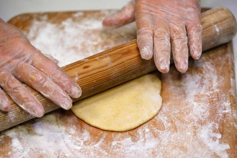 Dotty Griffith rolls out dough for tortillas 