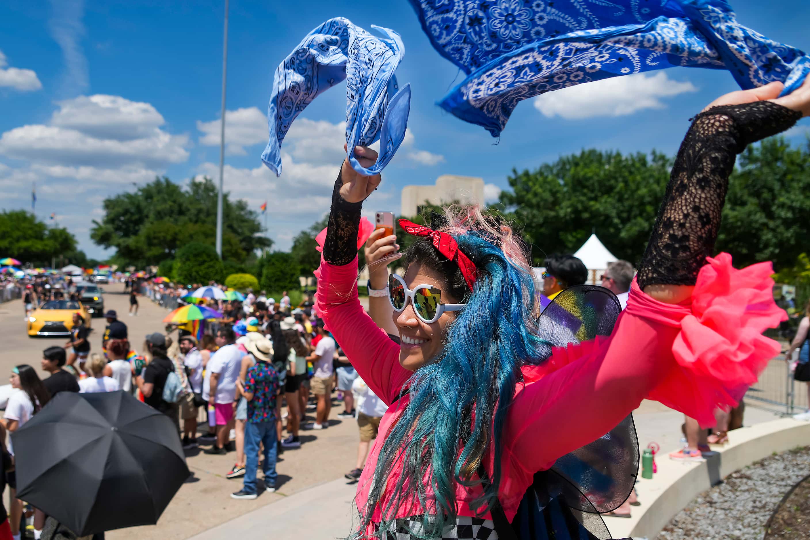 Vanessa Yxcea dances while cheering on parade participants during the annual Alan Ross Texas...