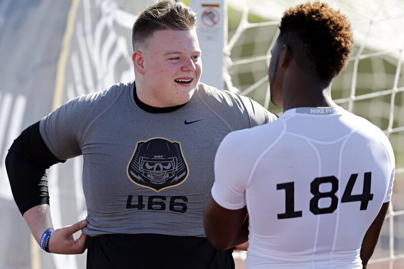 Jack Anderson (left) of Frisco talks to Baron Browning of Kennedale during the Nike+...